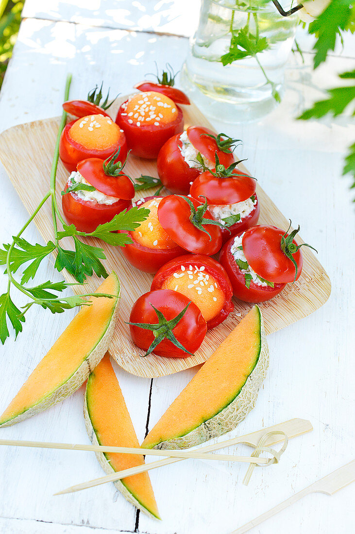Tomatoes stuffed with melon and tomatoes stuffed with fromage frais