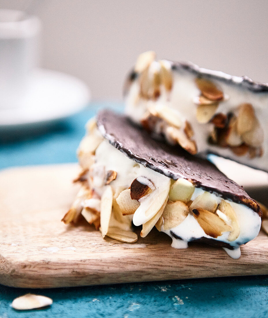 Chocolate tacos with vanilla ice cream and thinly sliced grilled almonds