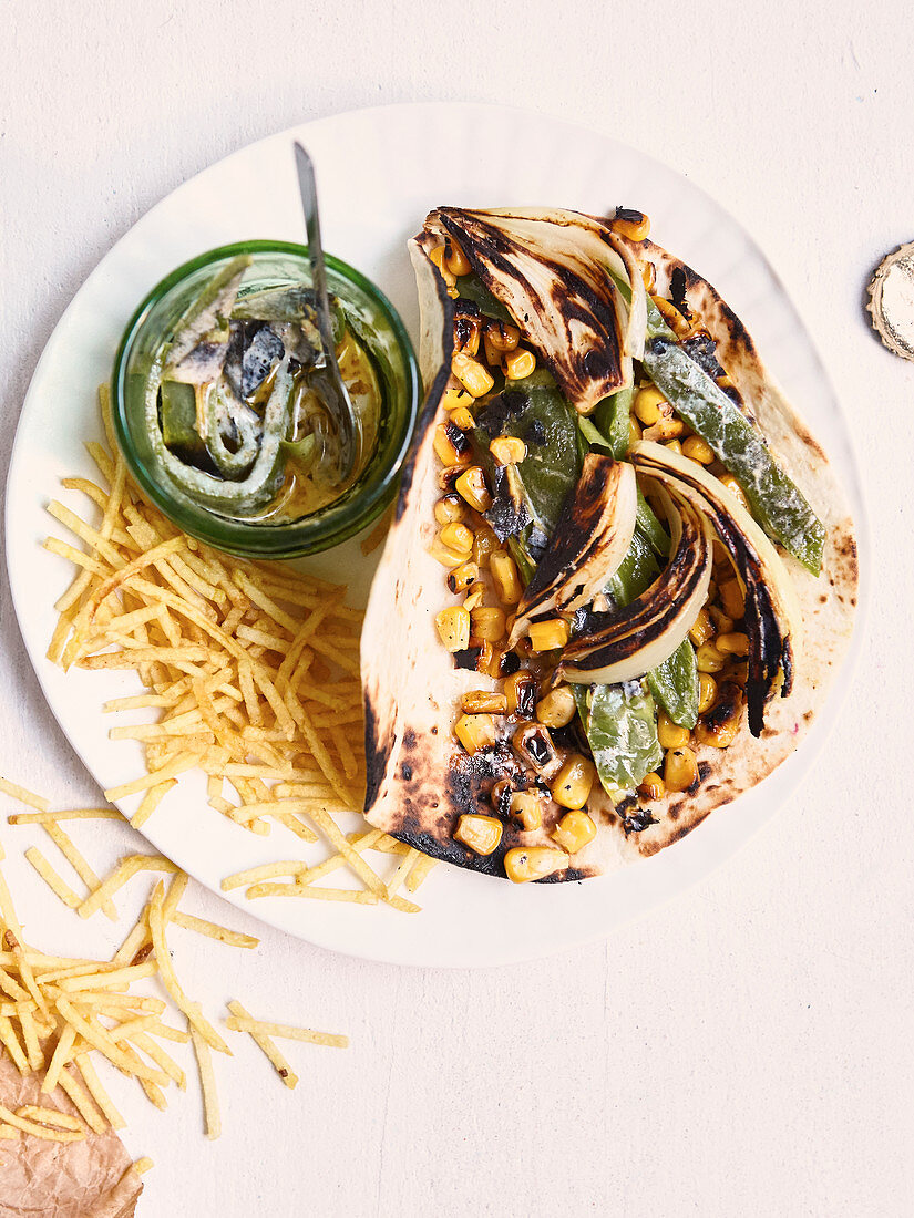 Wheat tortillas garnished with creamy green peppers,onions and grilled sweet corn