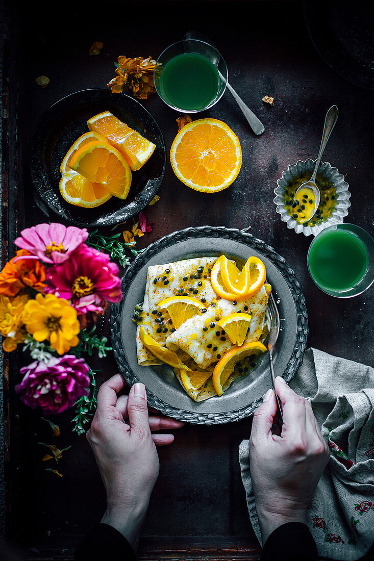 Crepes with ricotta cheese, passion fruit and orange