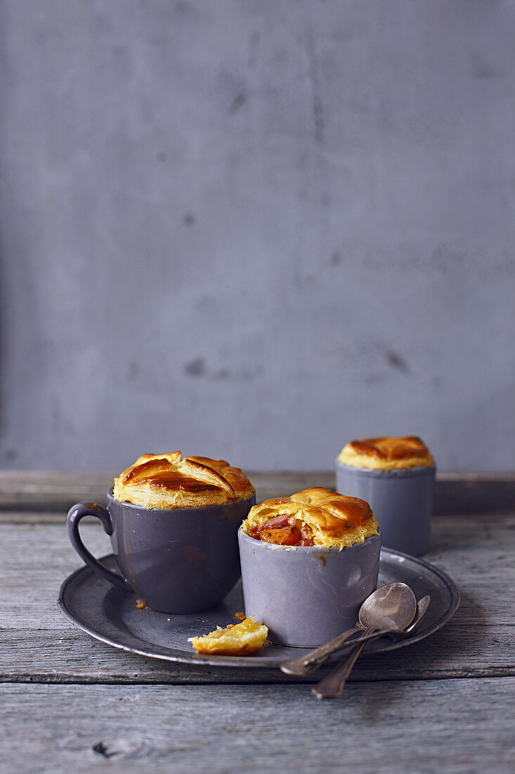 Young carrot and country sausage mini mug pies