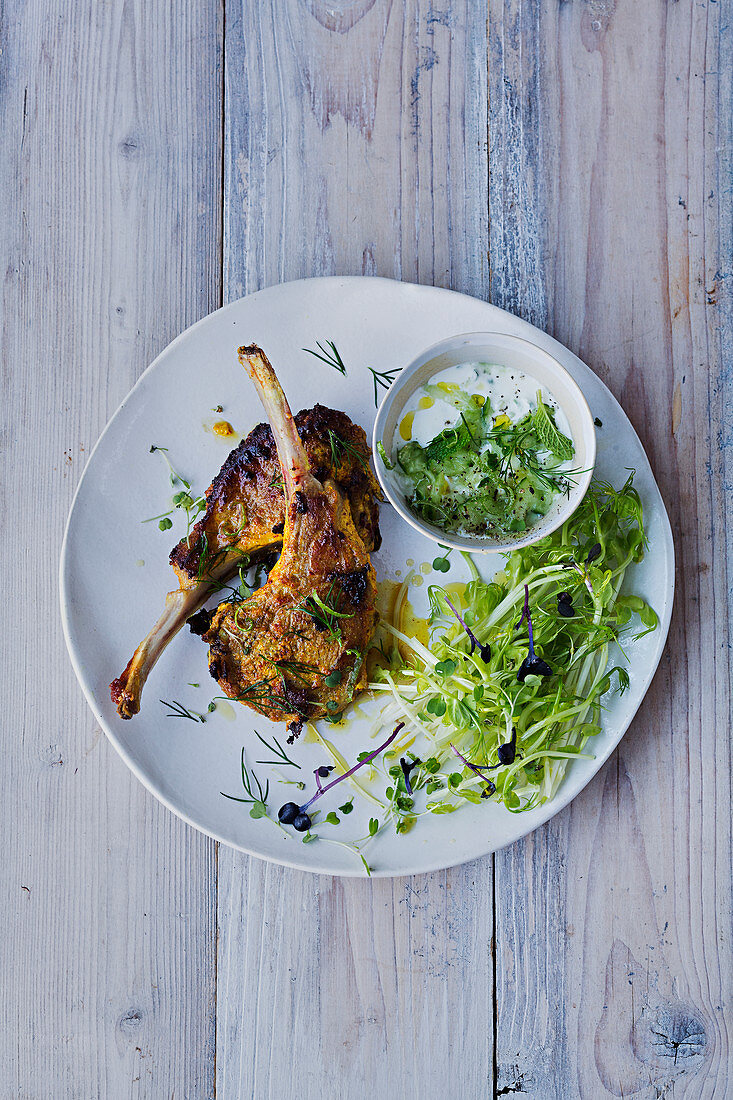Lamb chops marinated in crème fraîche and curry,sprout salad and yoghurt sauce