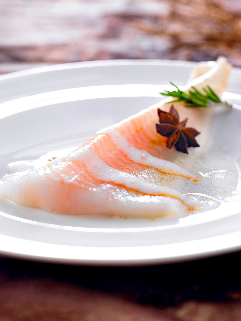 Pan-fried halibut fillet with aniseed juice and rosemary milk