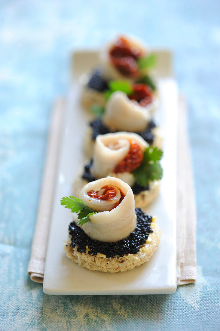 Rolled sole fillet,confit tomato and lumpfish roe appetizers