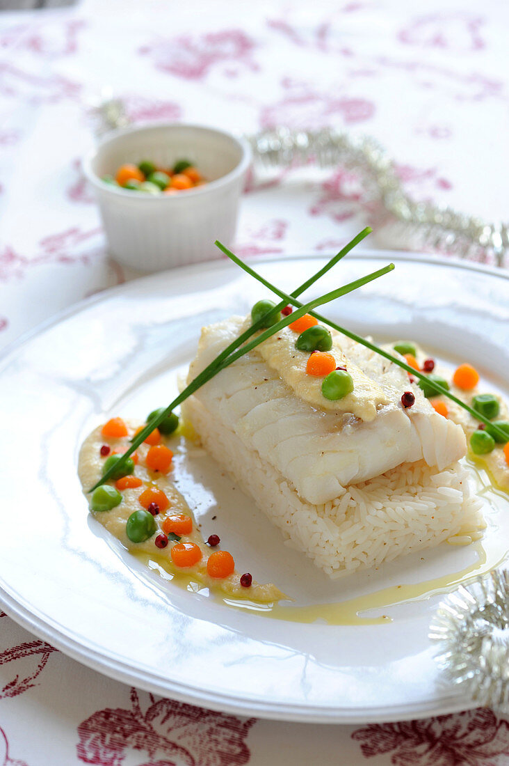Fillet of cod with citrus fruit sabayon,vegetable pearls with truffle oil and rice