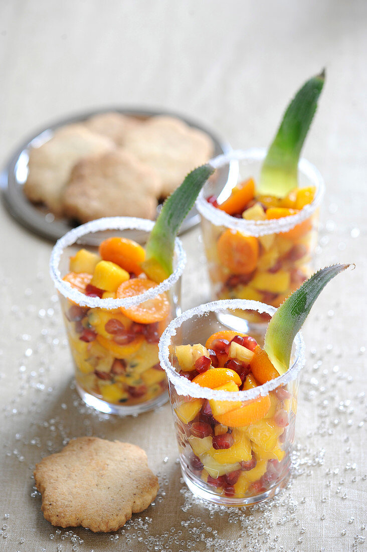 Spicy exotic fruit salads with rum and shortbread biscuits