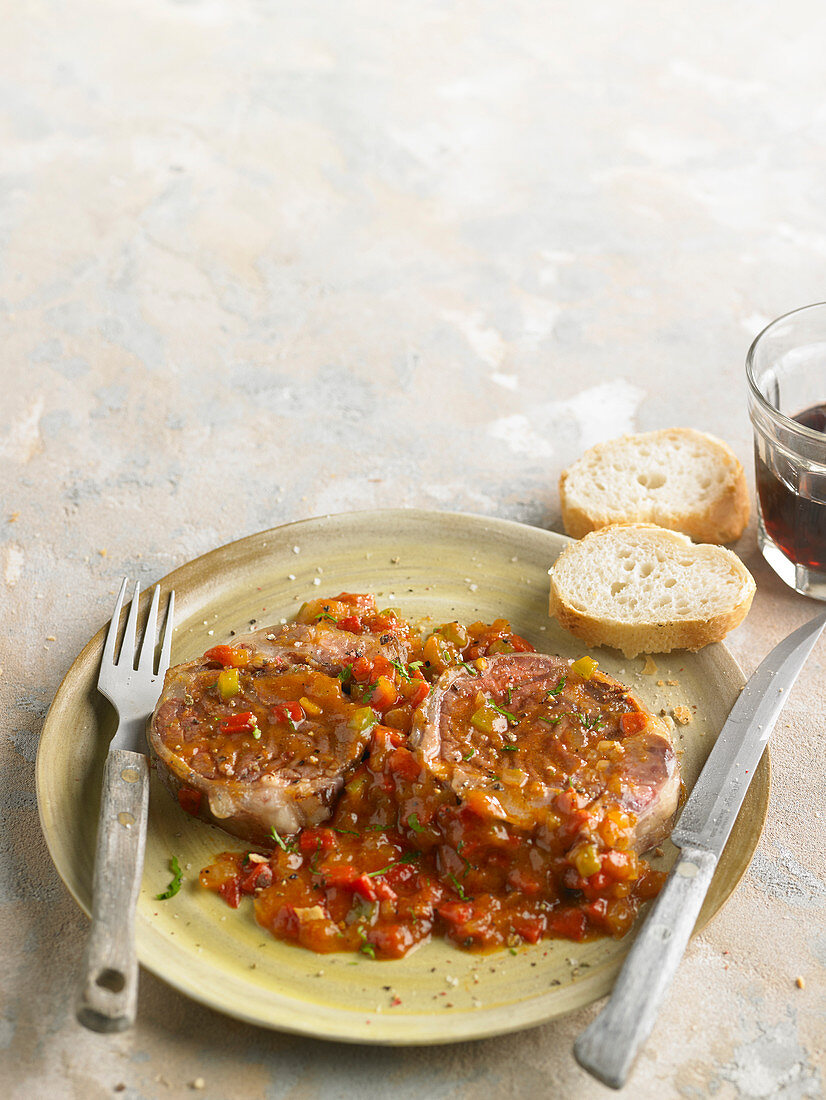 Knuckle Of Pork With Tomatoes And Peppers