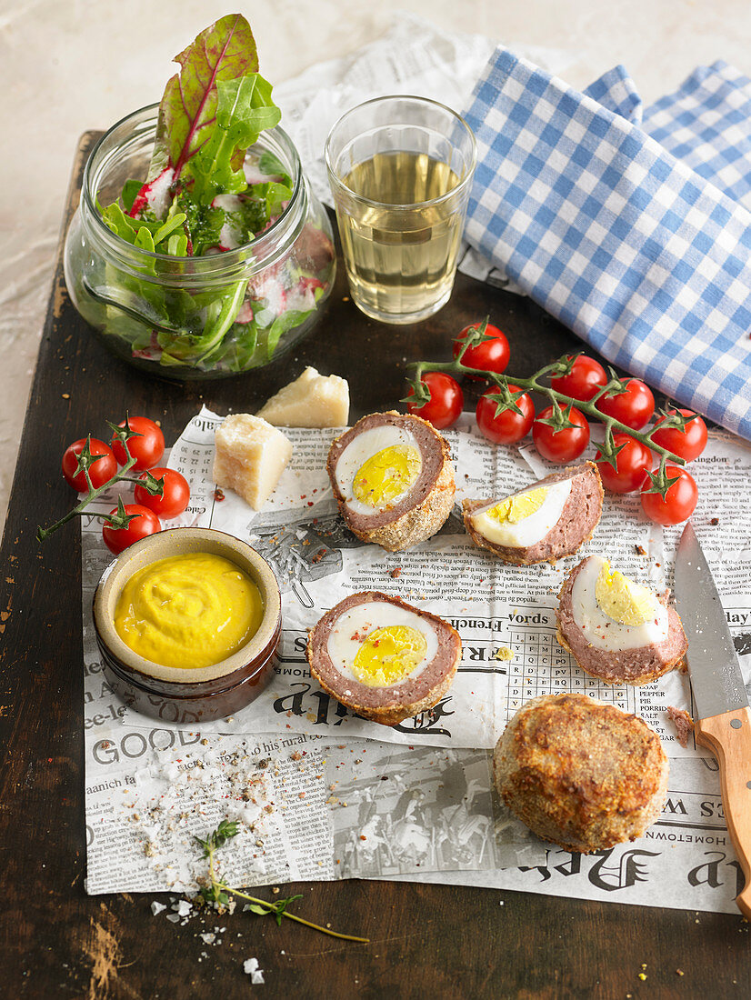 Baked Scotch eggs, rocket salad and radish