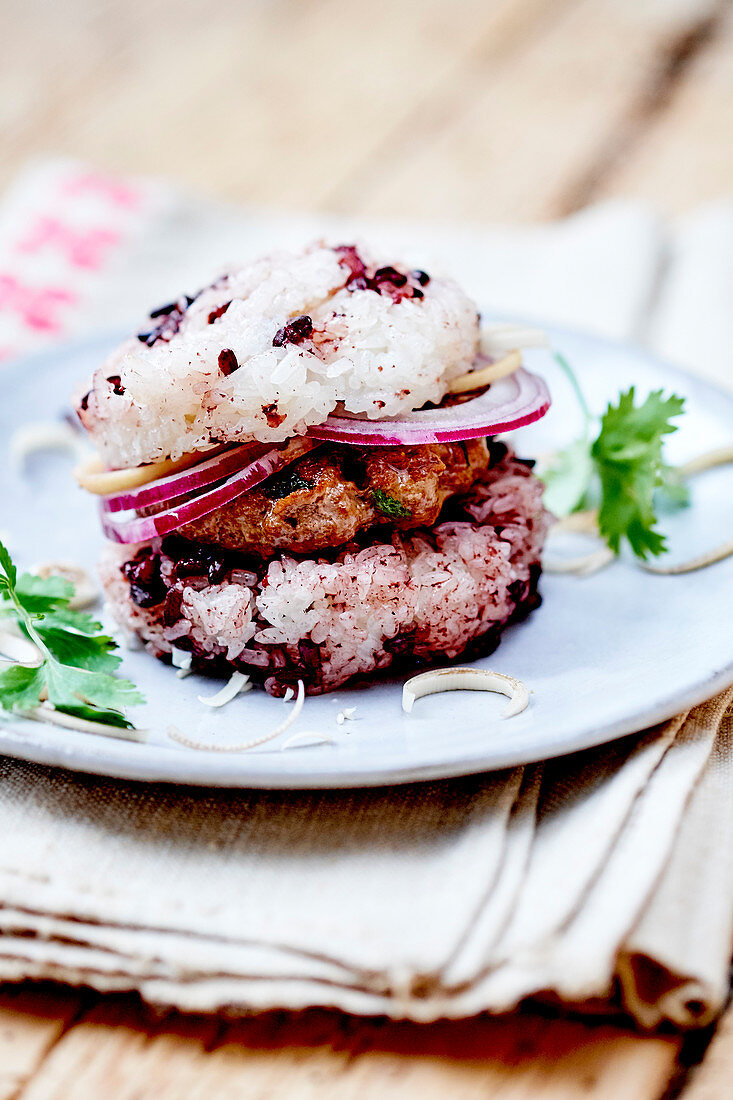 Black and white sticky rice veal and coriander burger