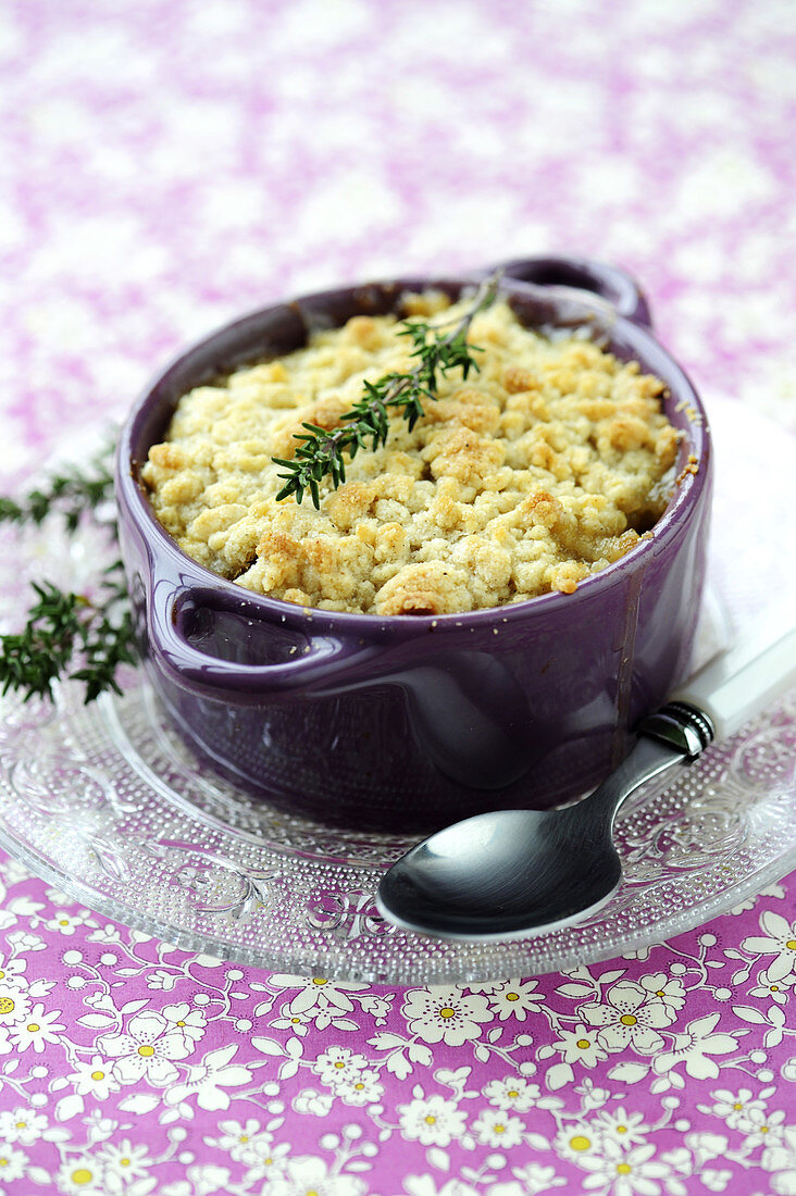Fruit crumble with green rosemary