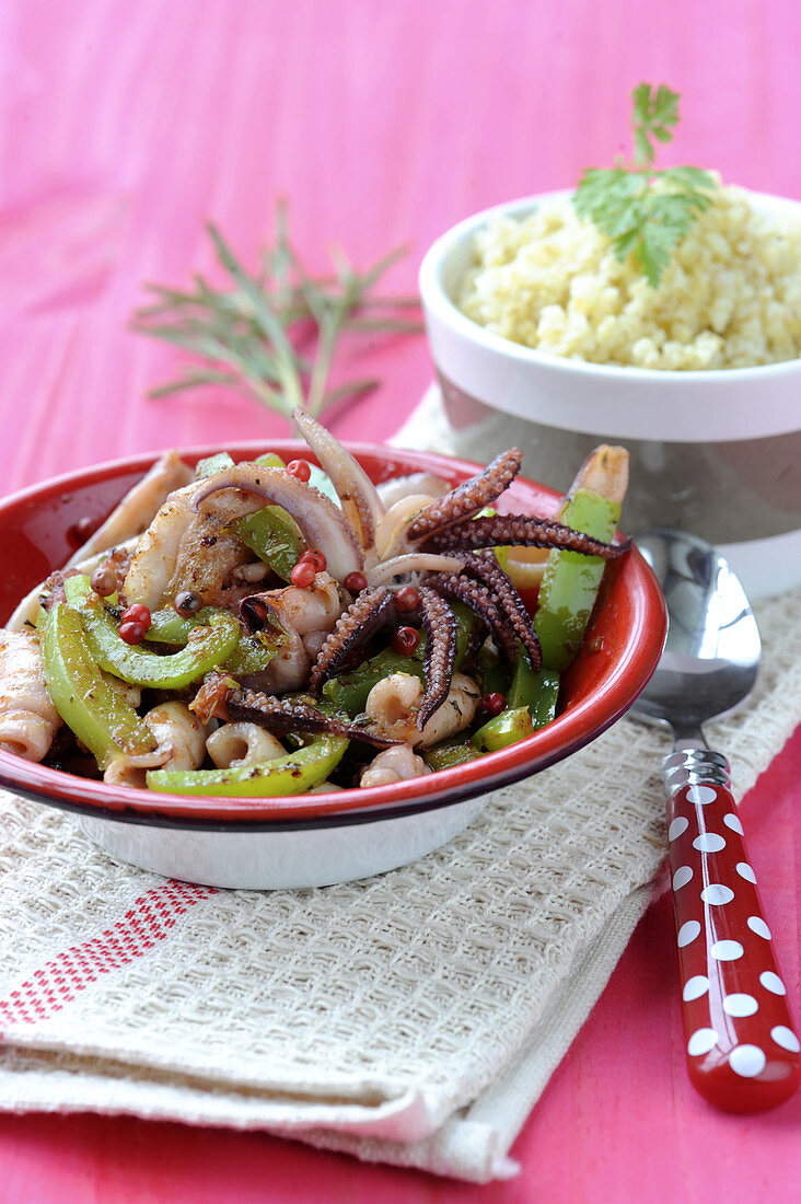 Squid sauté with peppers,paprika and bulgur