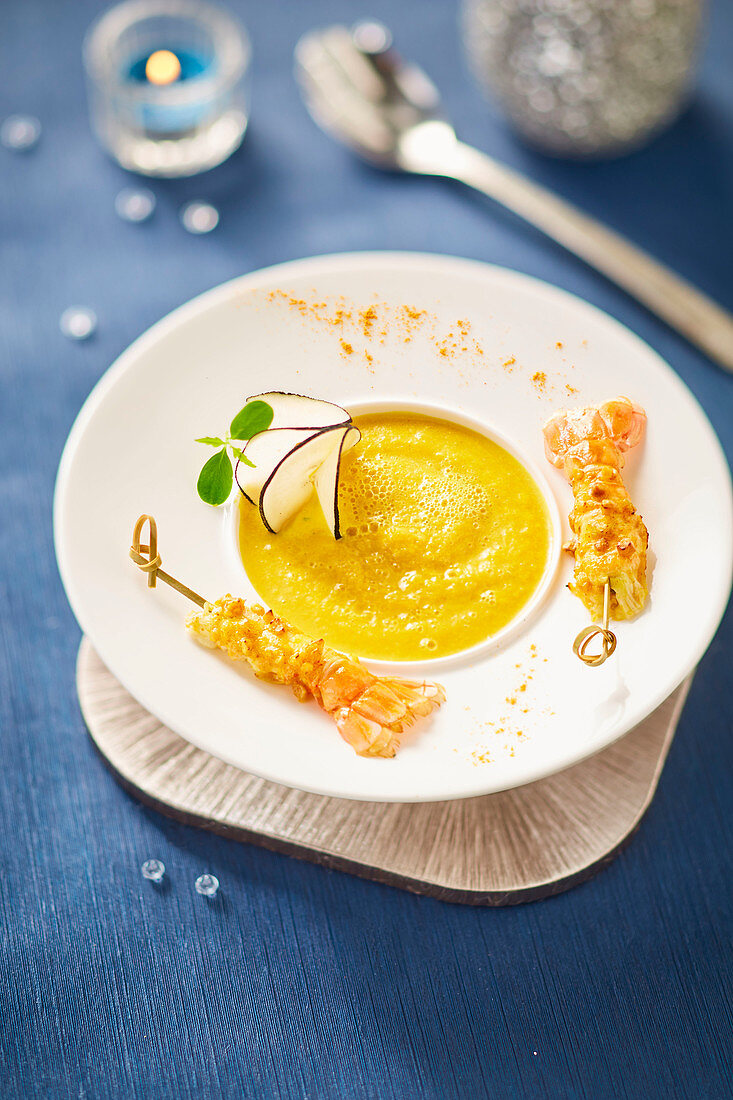 Cream of carrot and black radish soup,langoustines coated with creamy curry sauce