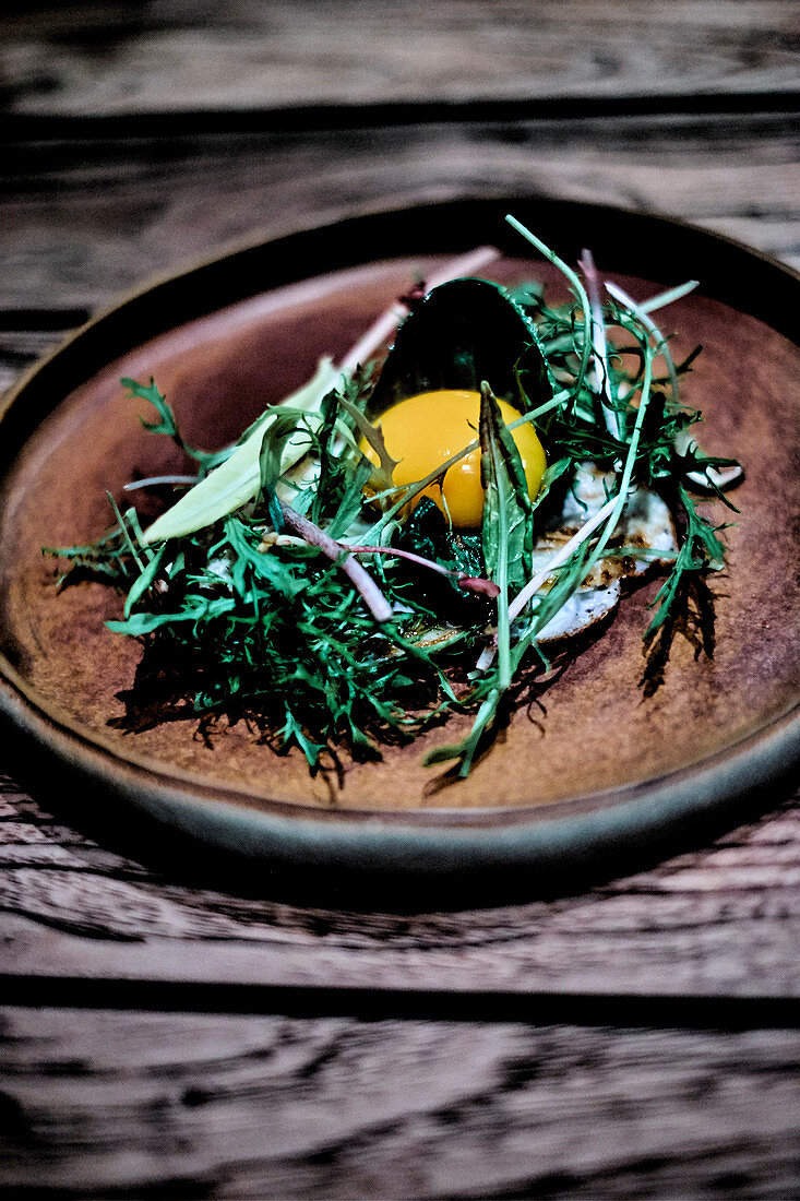 Black radish carpaccio,bushy herbs and a raw egg