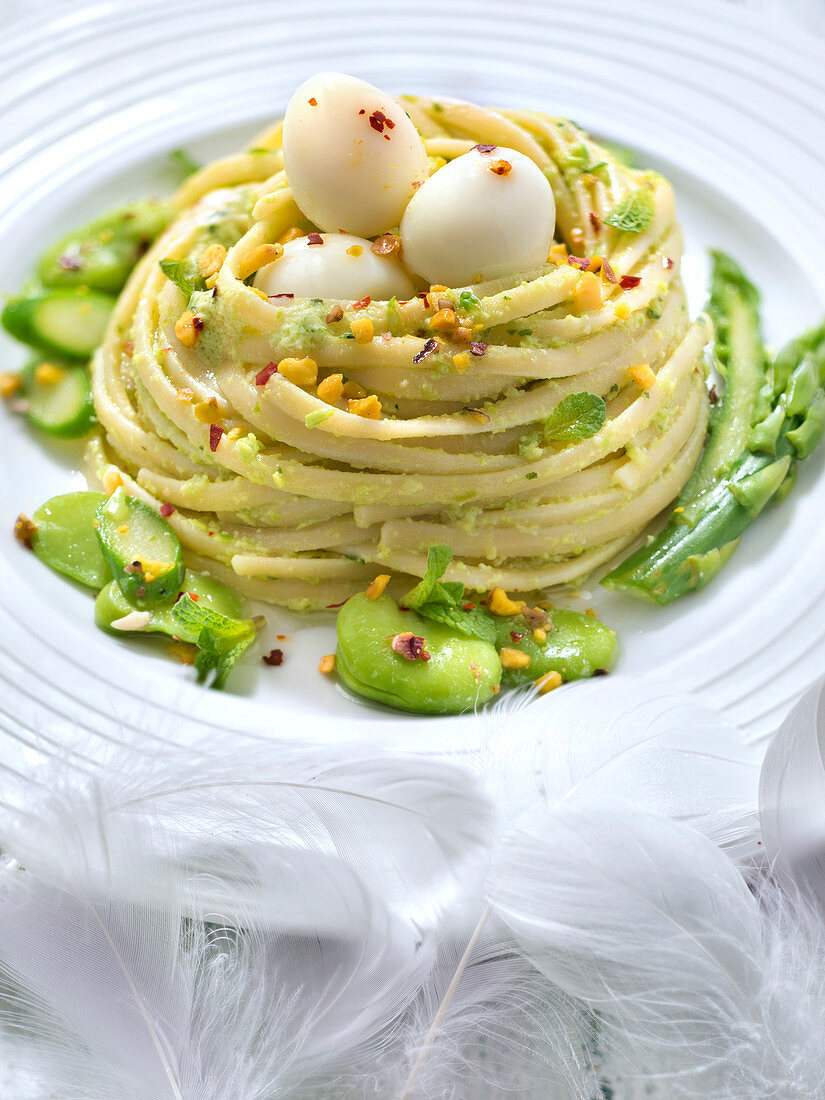 Pistachio pesto linguini nest,fresh broad beans,asparagus and quail's eggs