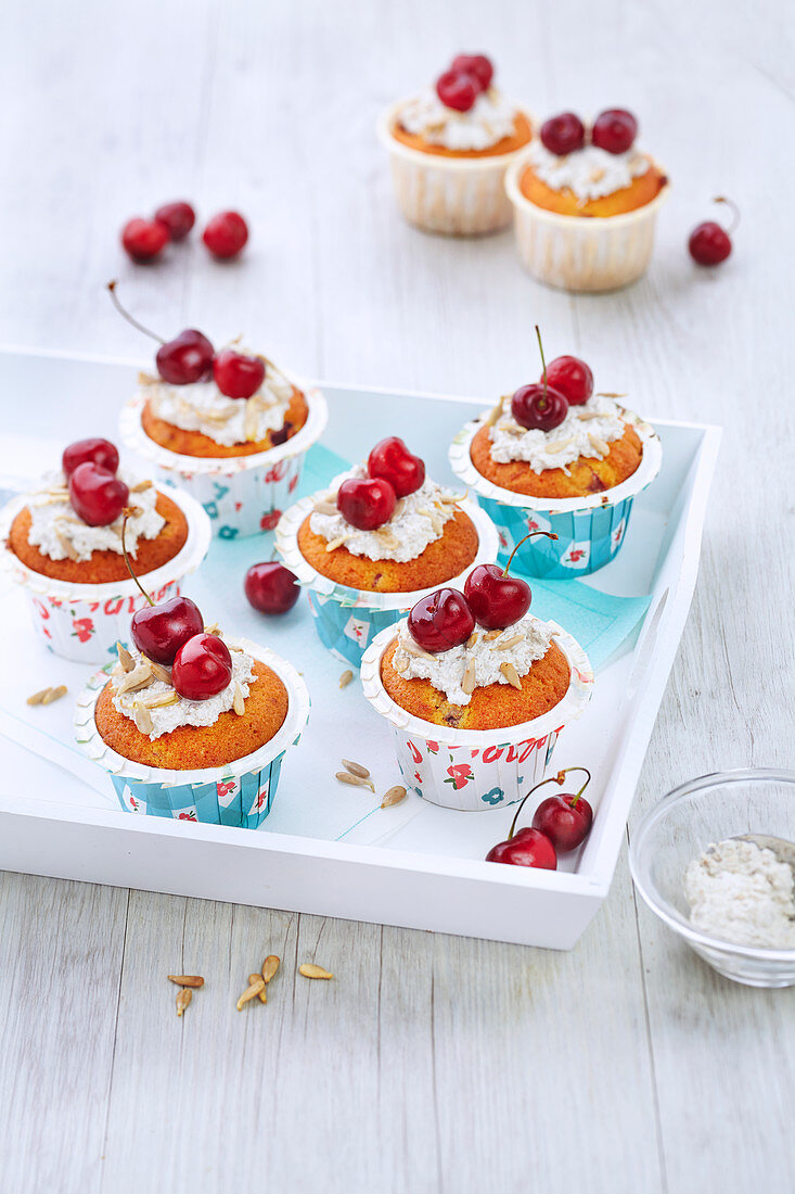 Cupcakes with cherries and sunflower seeds