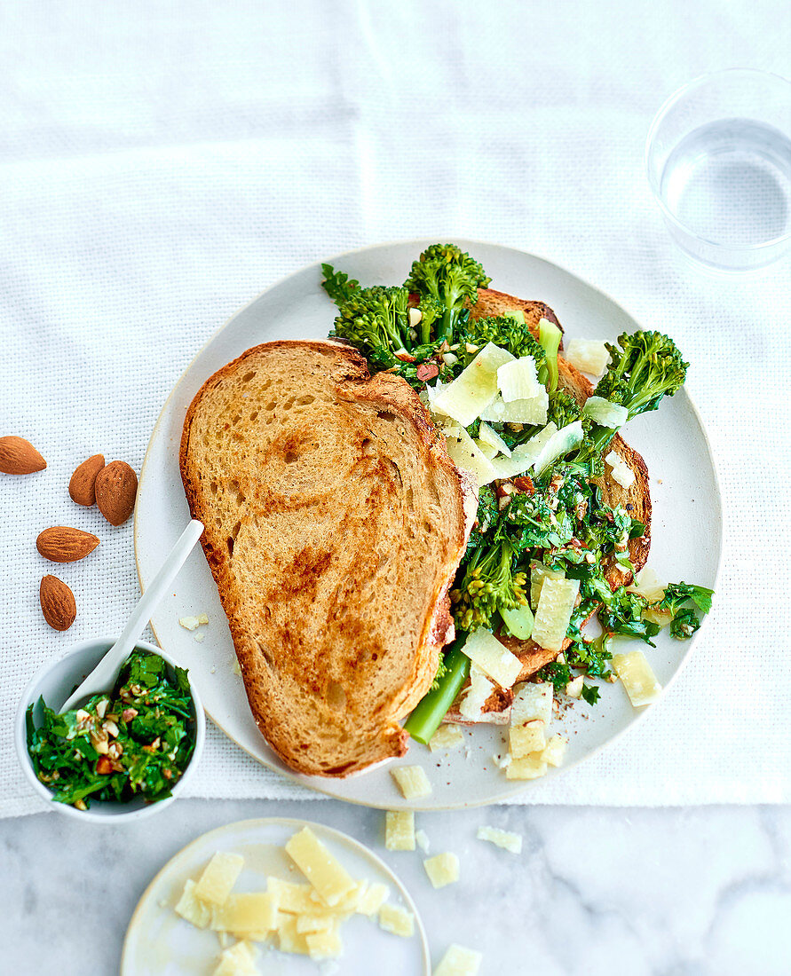 Veggie sandwich with broccolini, parmesan shavings and almond slivers