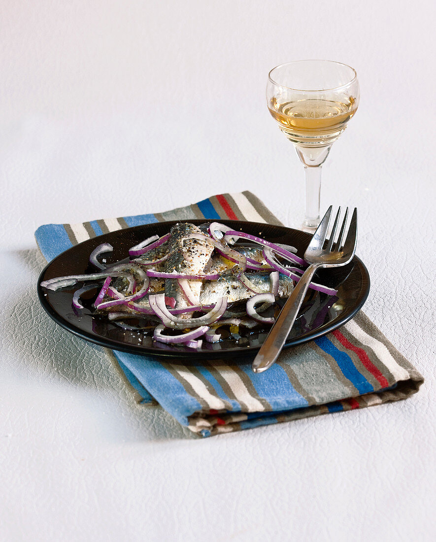 Fresh anchovies from Collioure and red onion salad
