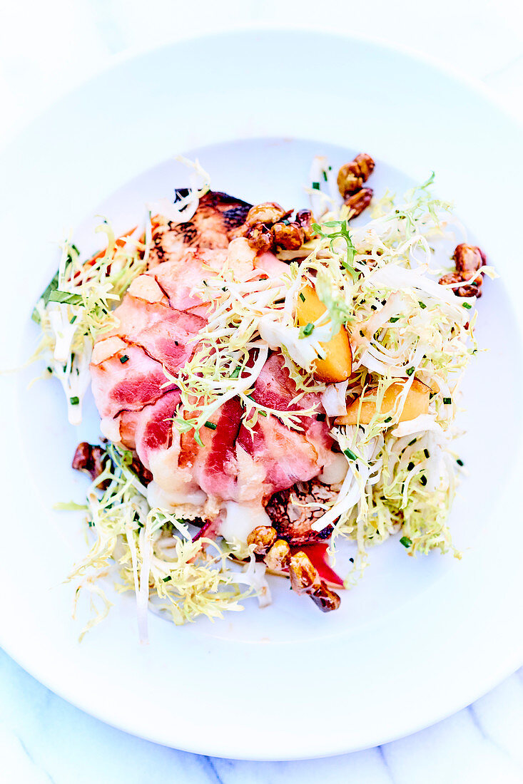 Endive salad with walnuts and maple syrup and roast beef carpccio