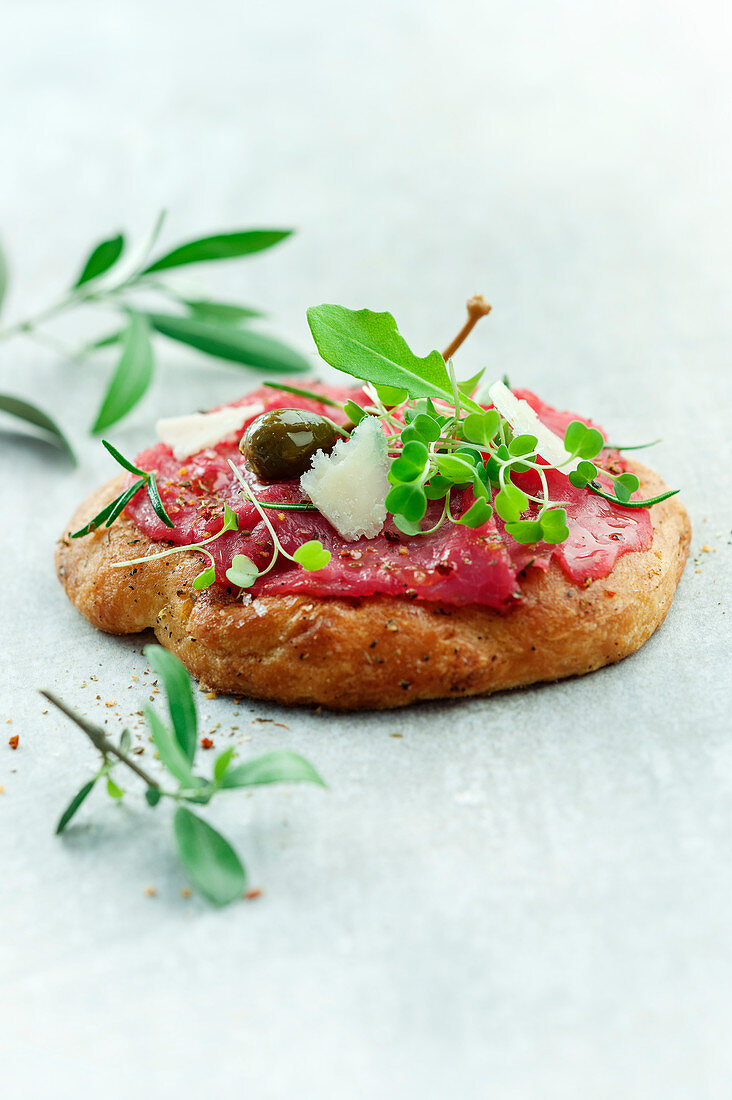 Beef carpaccio on oil bread