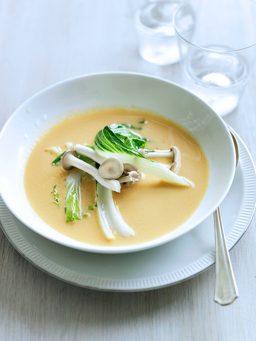 Red curry squash soup with bok choy and marinated mushrooms