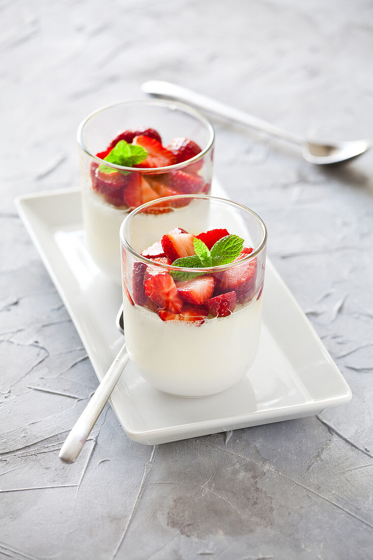Glasses Of Panna Cotta With Strawberries