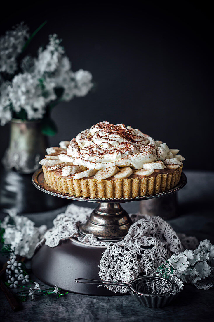 Banoffee Pie With A Biscuit Crust, Nutella Mousse, Bananas And Cream