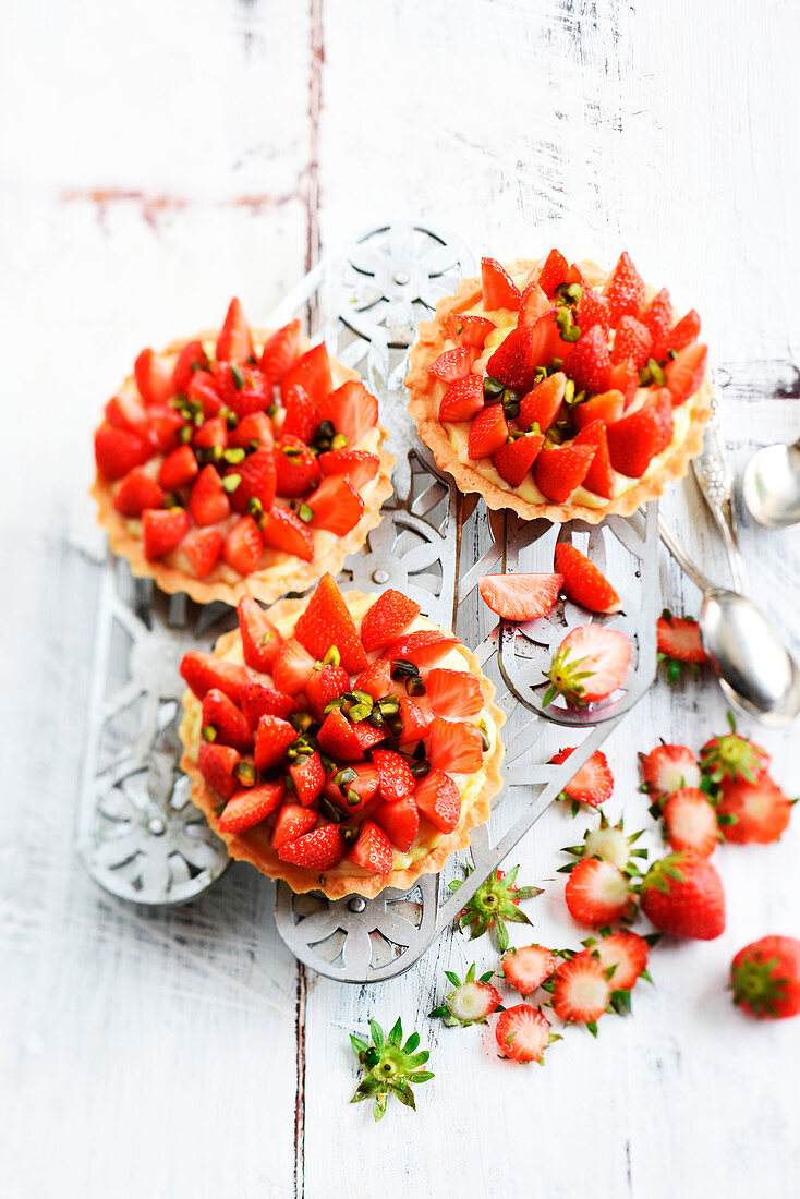 Strawberry and pistachio tartlets