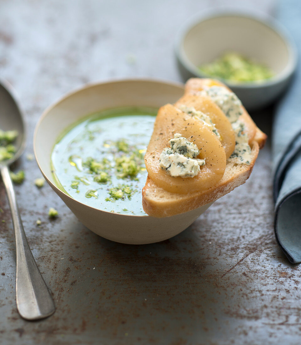 Broccoli soup, pear and blue cheese on sliced bread