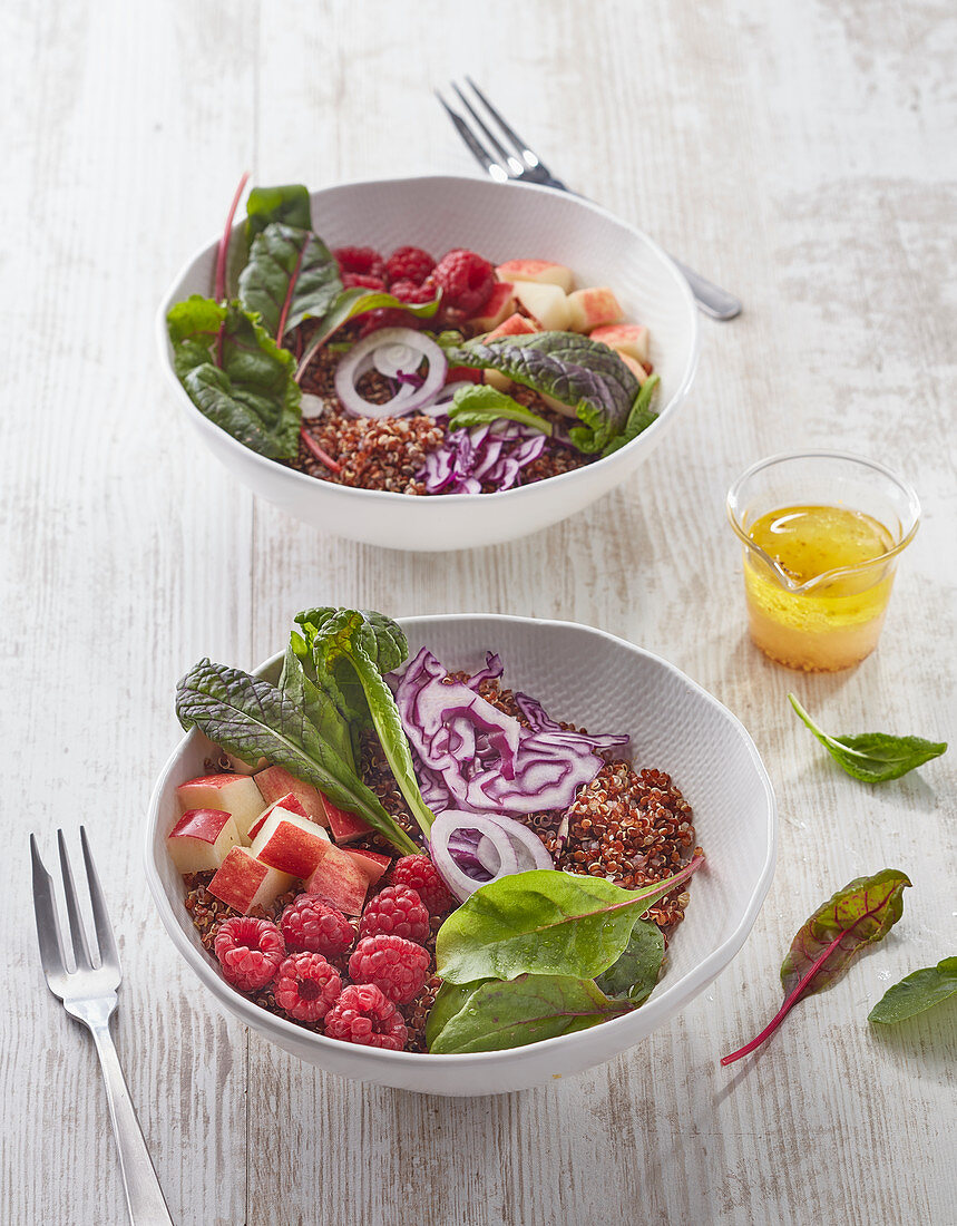 Quinoa, beetroot leaves and swiss chard baby leaves, apple, raspberries, cabbage and red onion Buddha bowl