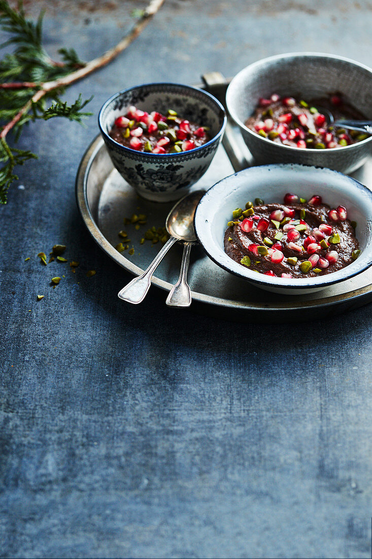 Full-bodied chocolate mousse with pomegranate and pistachios