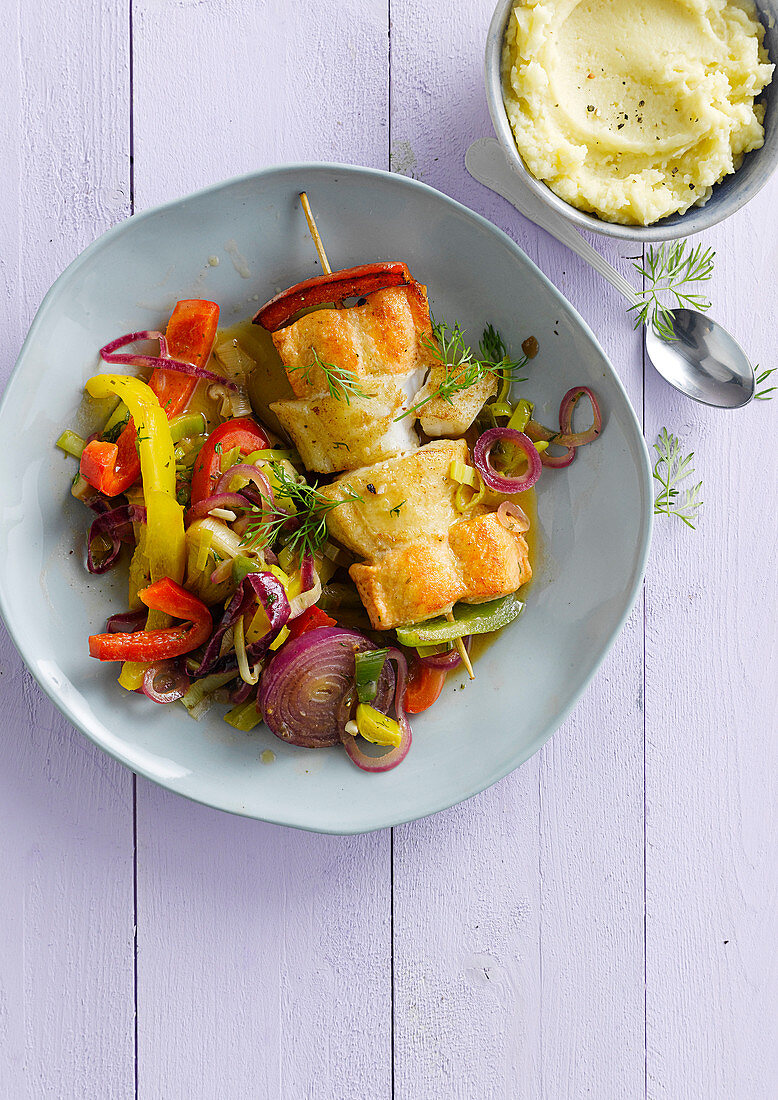 Skewer with two kinds of fish with summery pan-fried vegetables