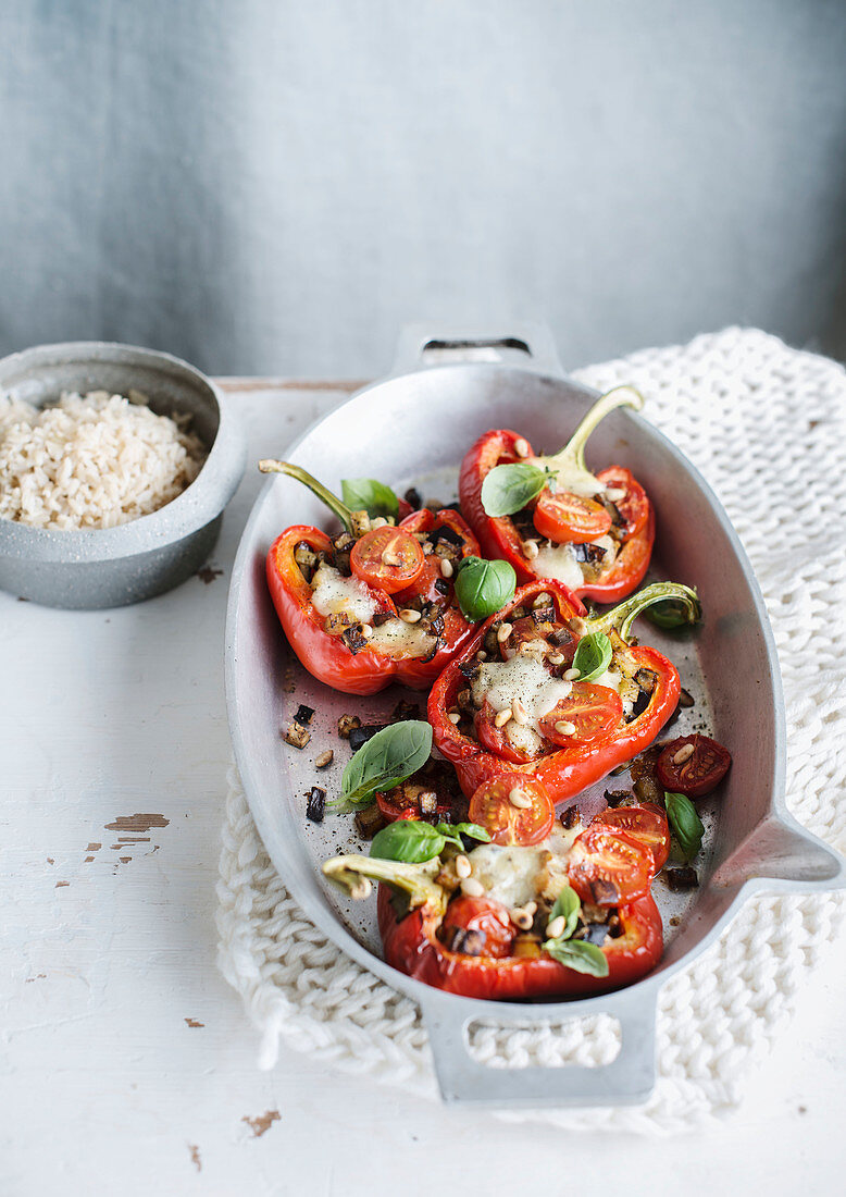 Stuffed peppers with aubergine, mozzarella and pine nuts