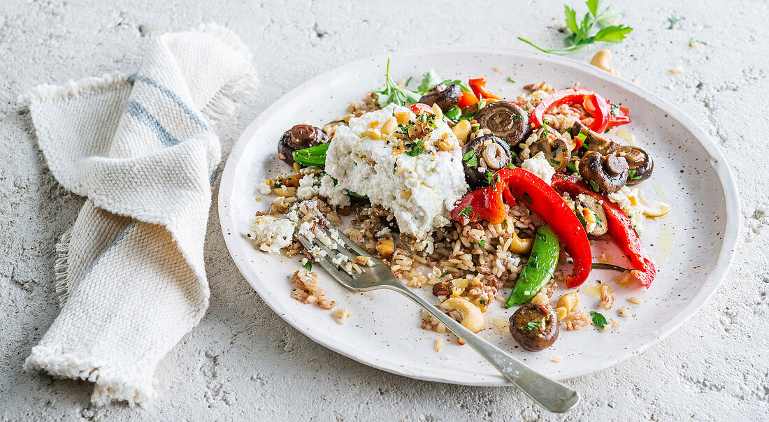 Ricotta on rice with mushrooms and vegetables