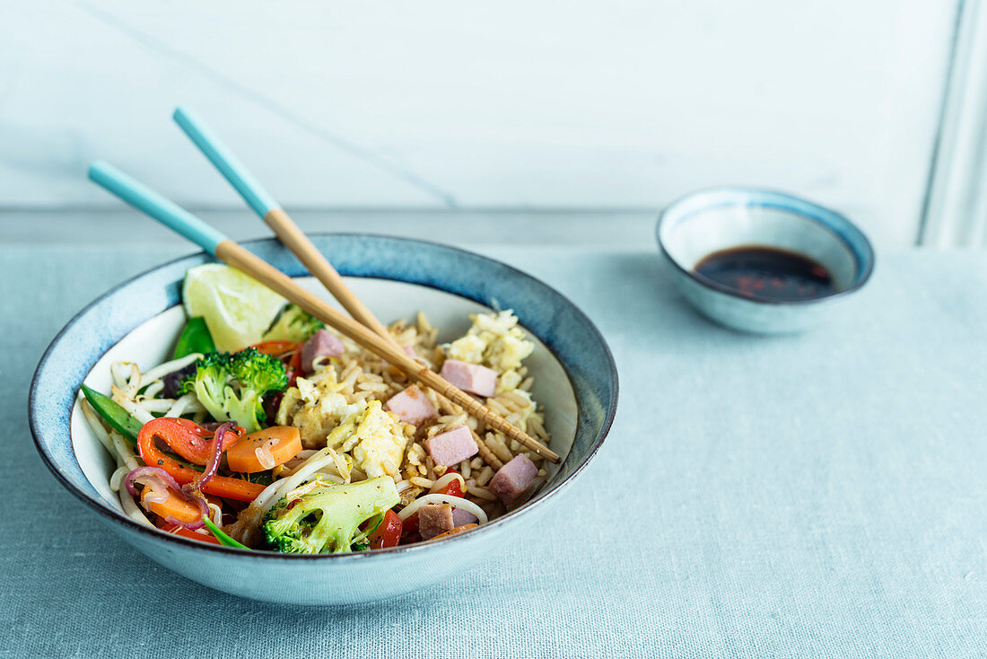 Fried rice from the wok with vegetables and ham (Asia)