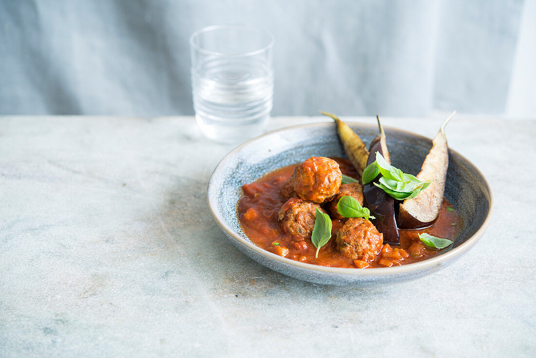 Meatballs in tomato sauce with roasted aubergines