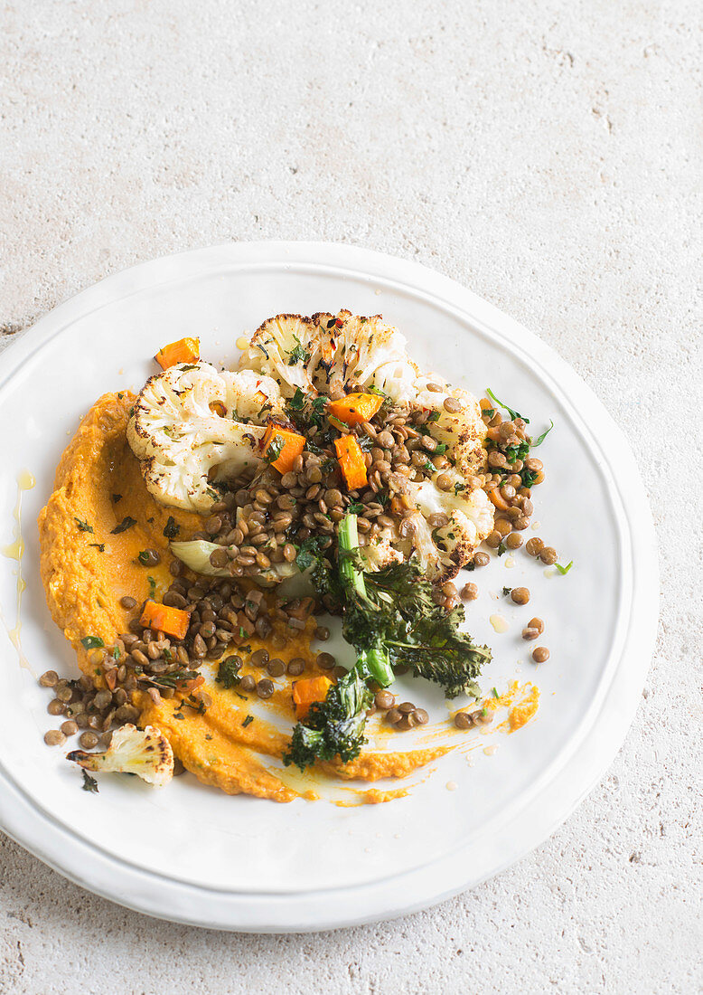 Roasted cauliflower with lentils and hummus
