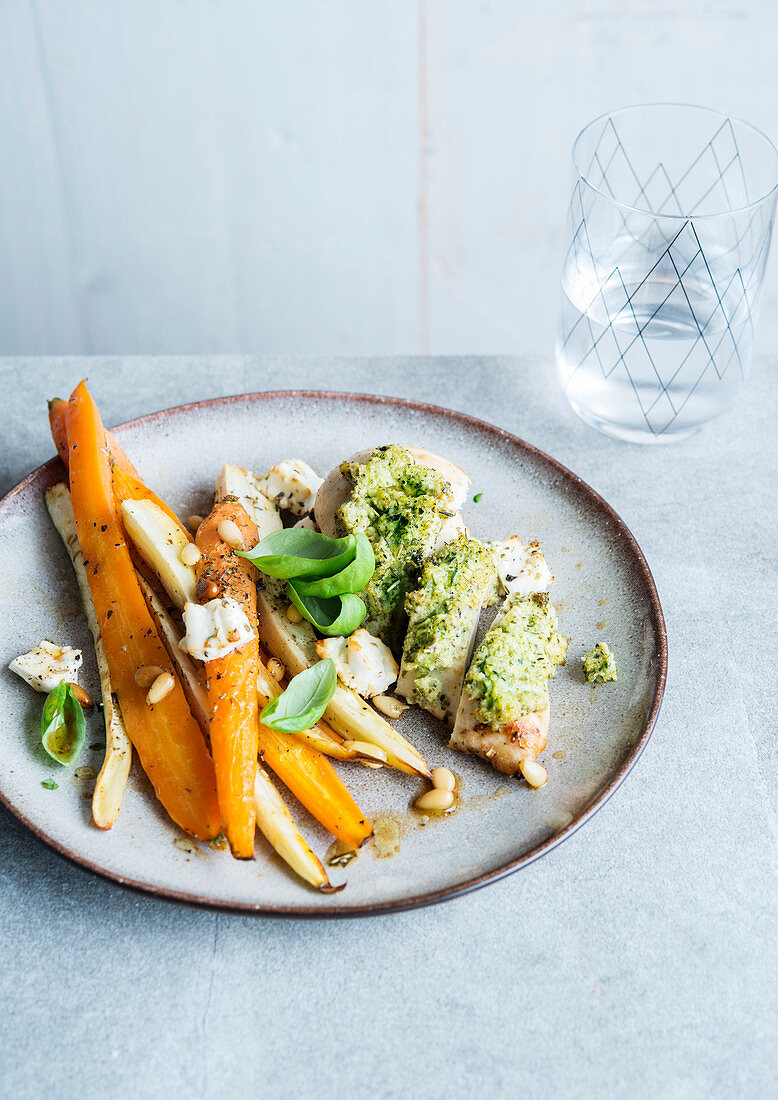 Chicken breast with pesto crust and roasted vegetables