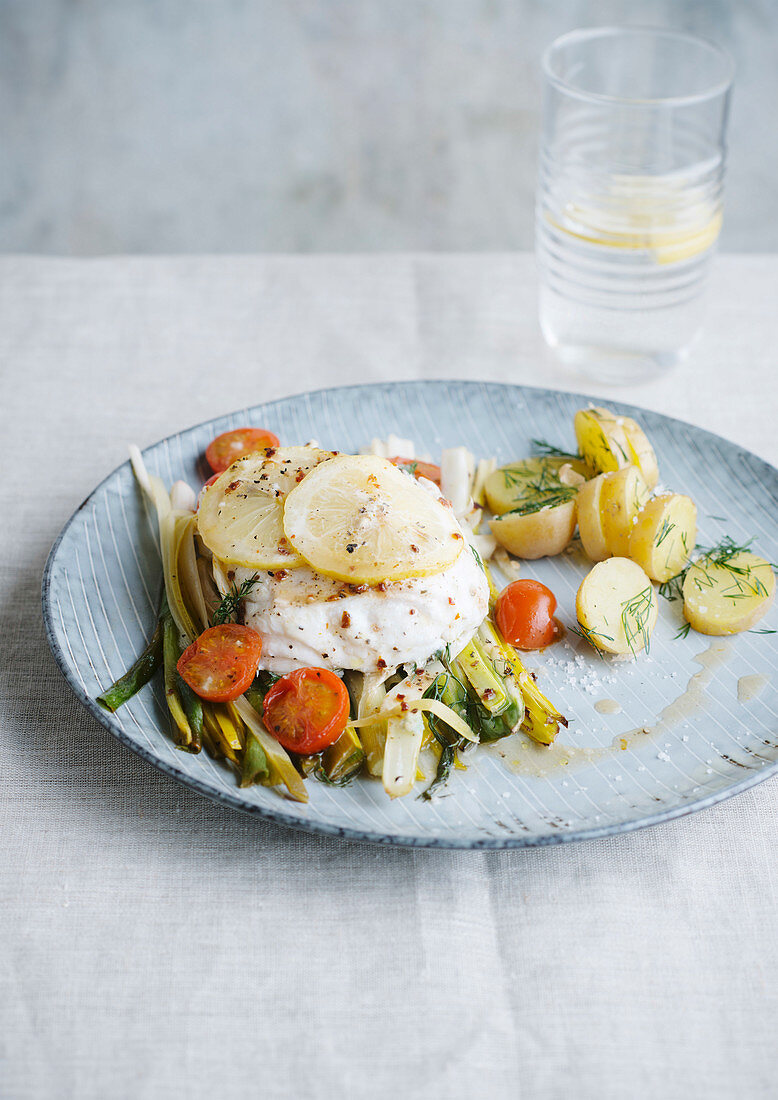 Steamed fish with lemon, fried leek and dill potato