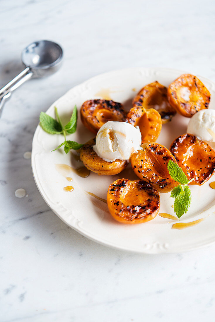 Grilled apricot with honey and vanilla ice cream