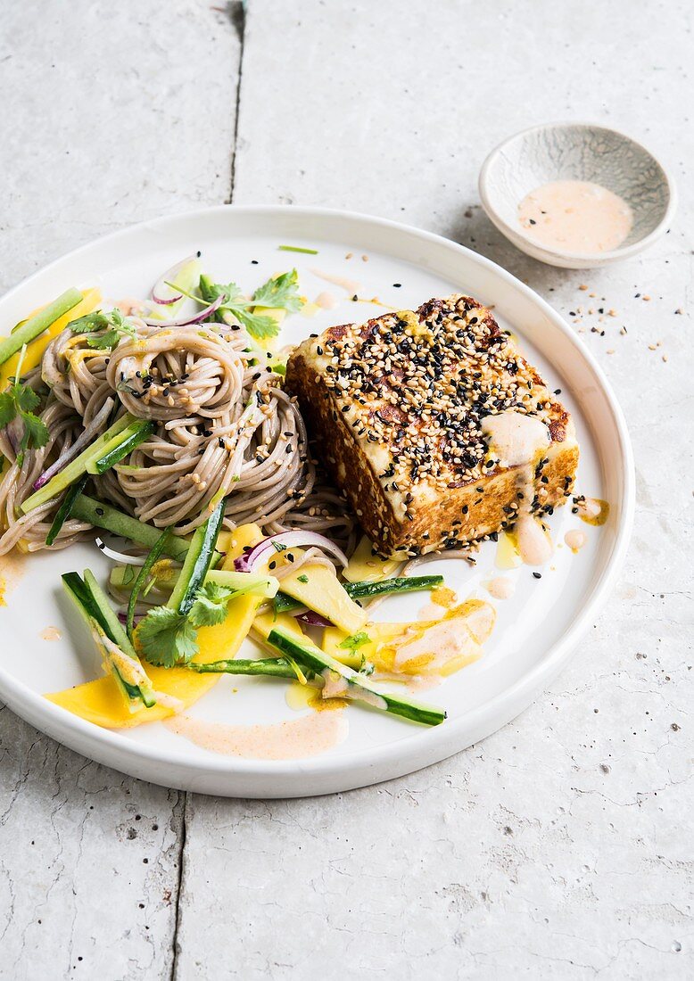 Fried paneer with sesame seeds, soba noodles and mango