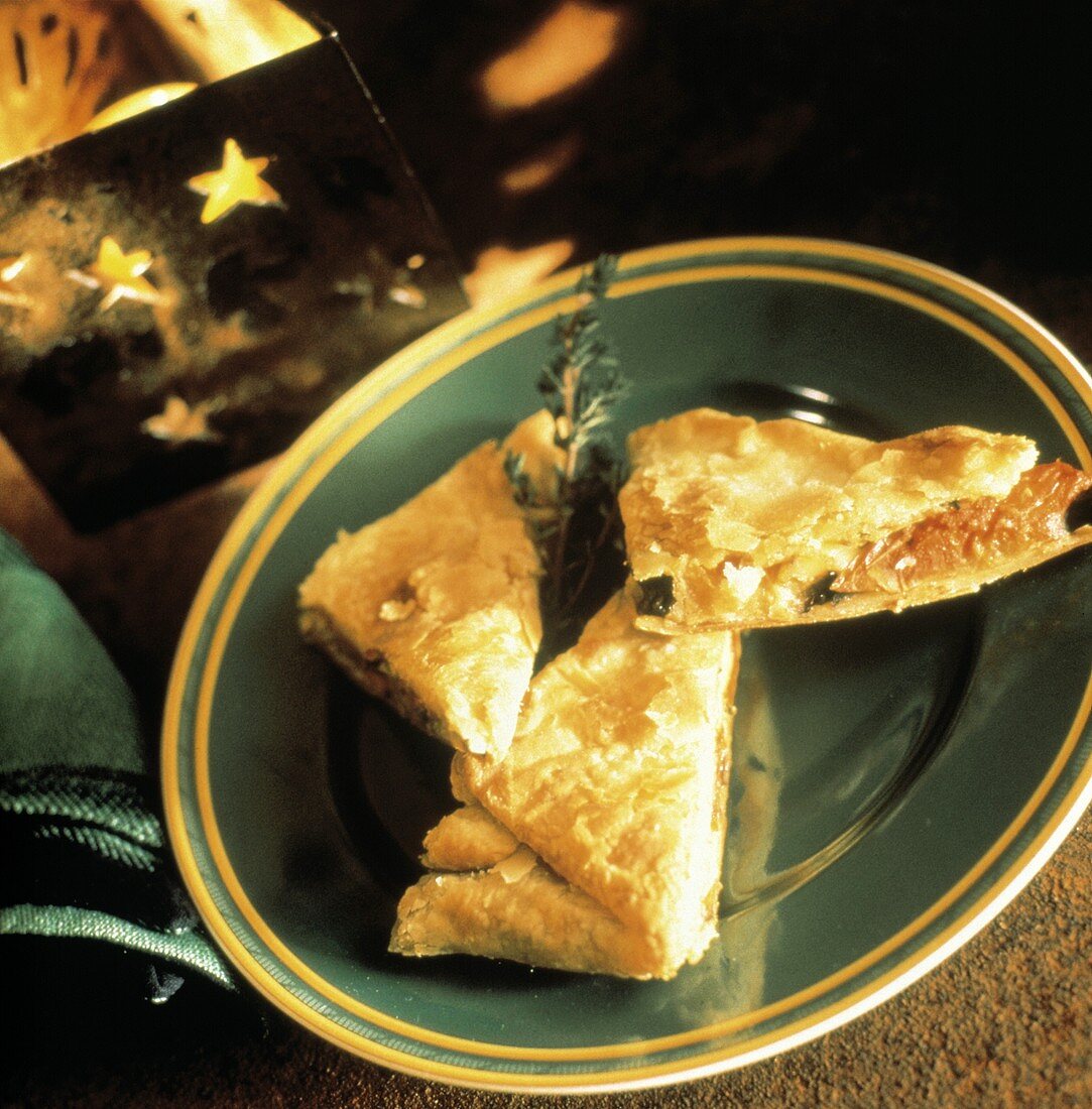 Three Strudel Appetizers on a Green Plate