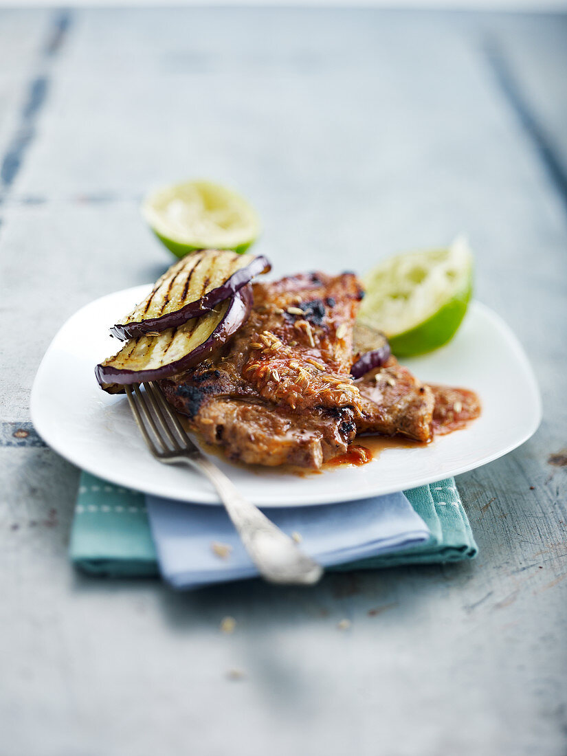 Grilled pork neck steak and aubergine