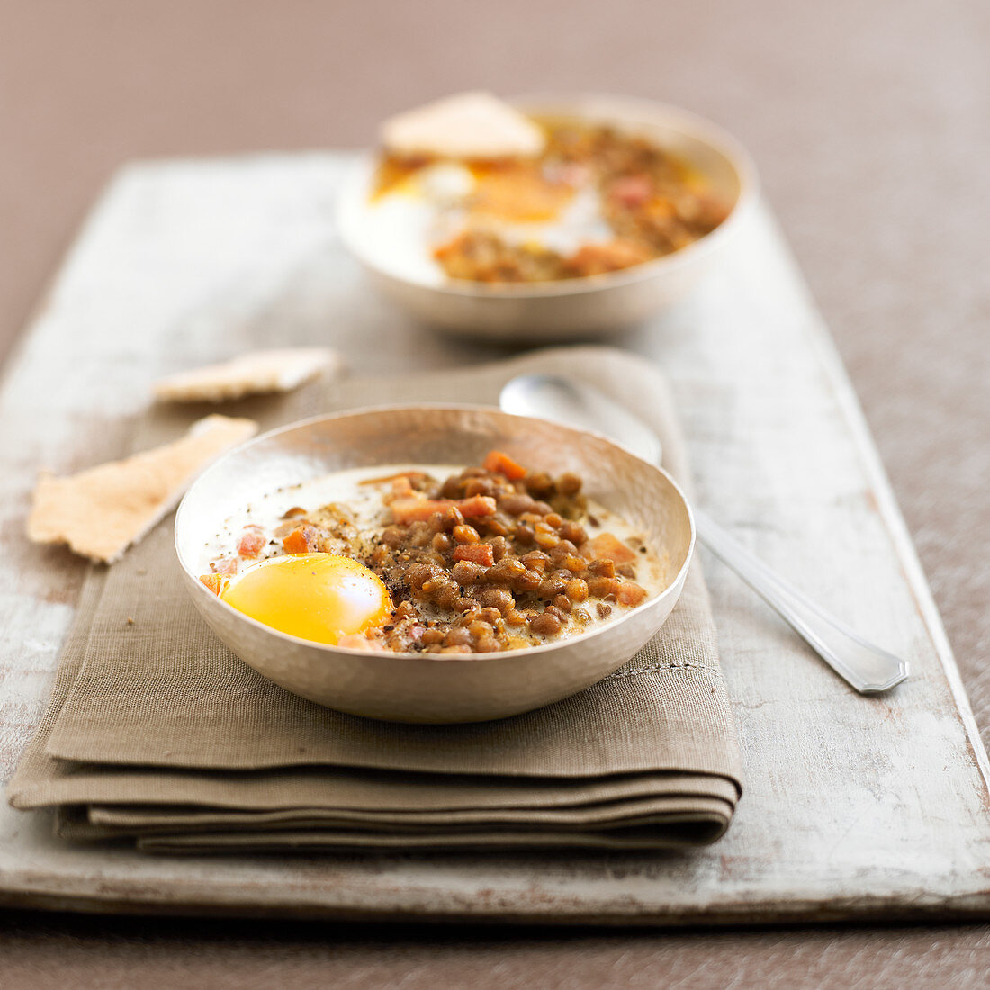 Oeuf cocotte with lentil colombo