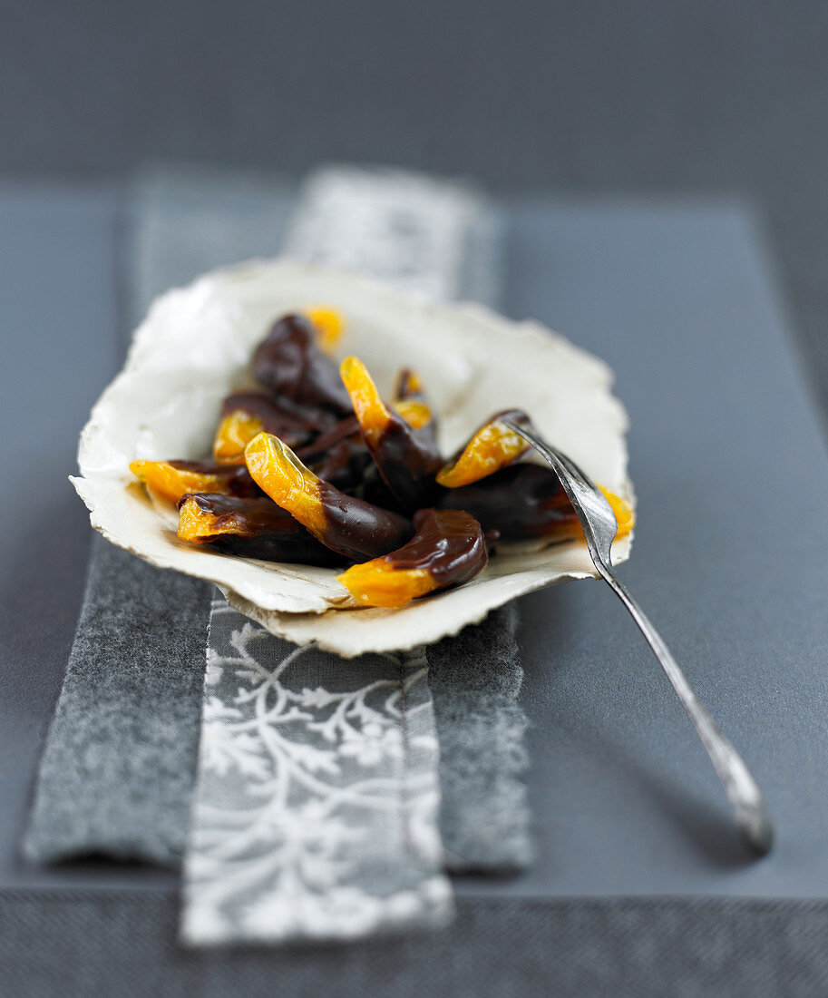 Candied clementines with chocolate coating