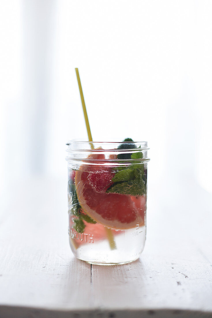 Detox water with pink grapefruit and herbs