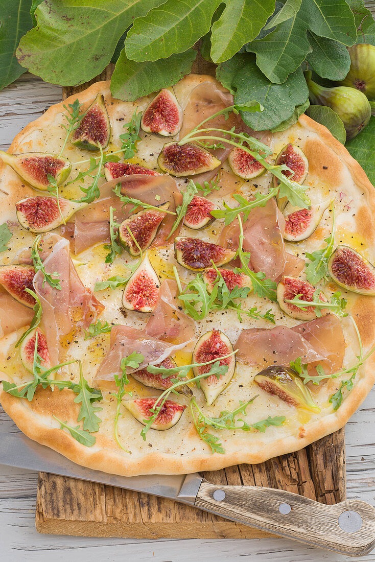 Pizza Bianca with raw ham, figs and rocket salad