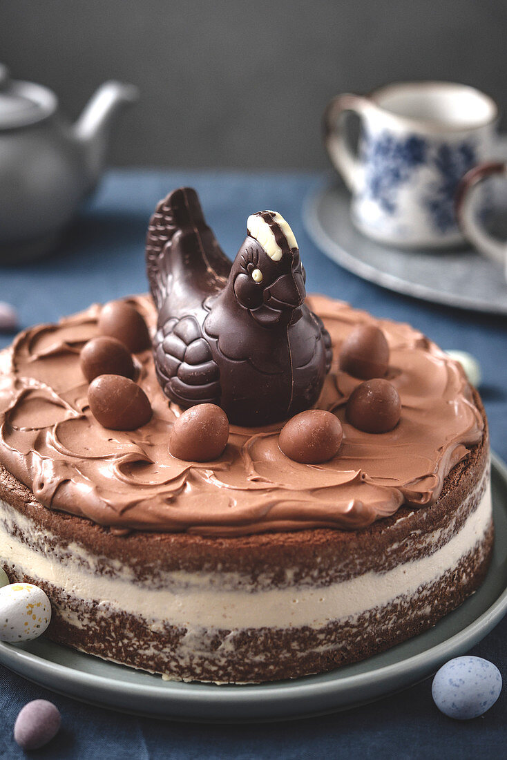 Easter chocolate cake decorated with a chocolate chicken and chocolate eggs