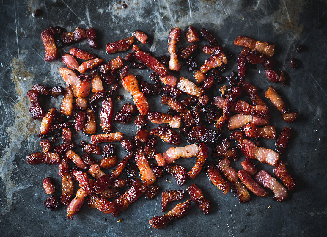 Grilled bacon cubes on an oven tray