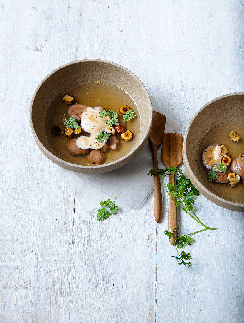 Autumn broth with chestnuts, coffee and mushrooms