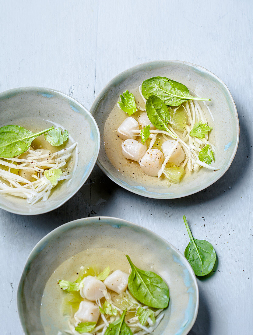 Clear broth with scallops and celery